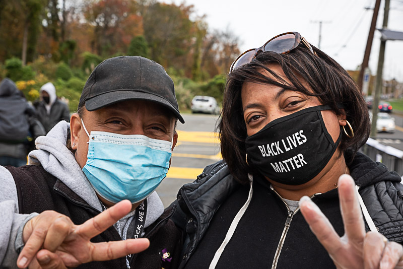 Community members show peace signs on BLM Mural site