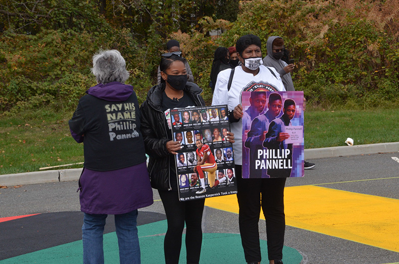 Natacha Pannell and her Mother holding Phillip Pannell posters