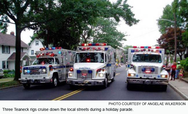 Three Teaneck rigs cruise down the local streets during a holiday parade.